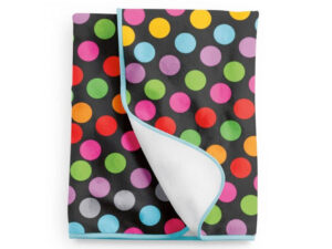 Custom-printed polar fleece blanket with sublimation printing. Blanket with colorful polka dots. One side fully personalized. AMGS Group.