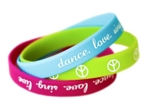 Personalized silicone wristbands with prints in various colors. From AMGS Group.