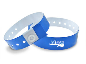 Blue vinyl wristbands with white "Music Festival" text and guitar graphic. Professional branding on event gadgets. AMGS Group realization.