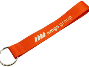 A short orange polyester keychain with a sublimation print and a metal keyring from AMGS Group.