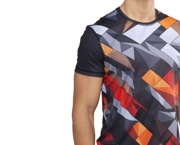 Close-up of the men’s Sport Coolmax T-shirt with sublimation print – a dynamic composition of geometric shapes in shades of red, orange, white, and graphite. Made from breathable Coolmax fabric, perfect for intense workouts. Available at AMGS Group.