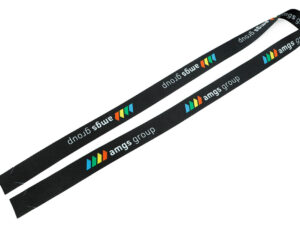 A long, flat strip of printed r-PET tape ready to be assembled into a custom hookless promotional lanyard.
