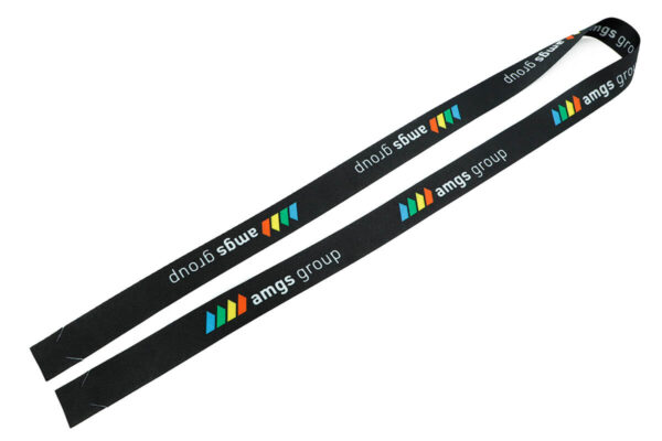 A long, flat strip of printed r-PET tape ready to be assembled into a custom hookless promotional lanyard.
