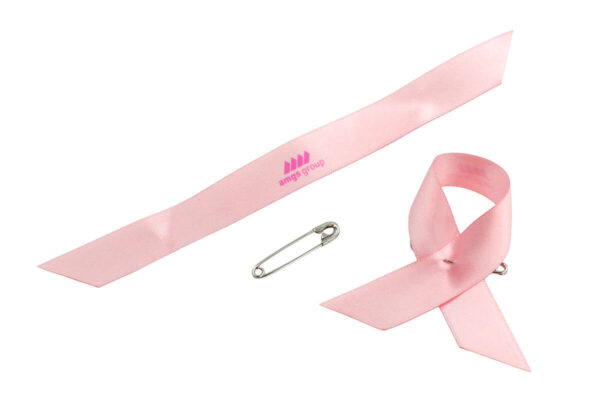 Pink satin awareness ribbon pin with safety pin and logo print, manufacturer AMGS Group.